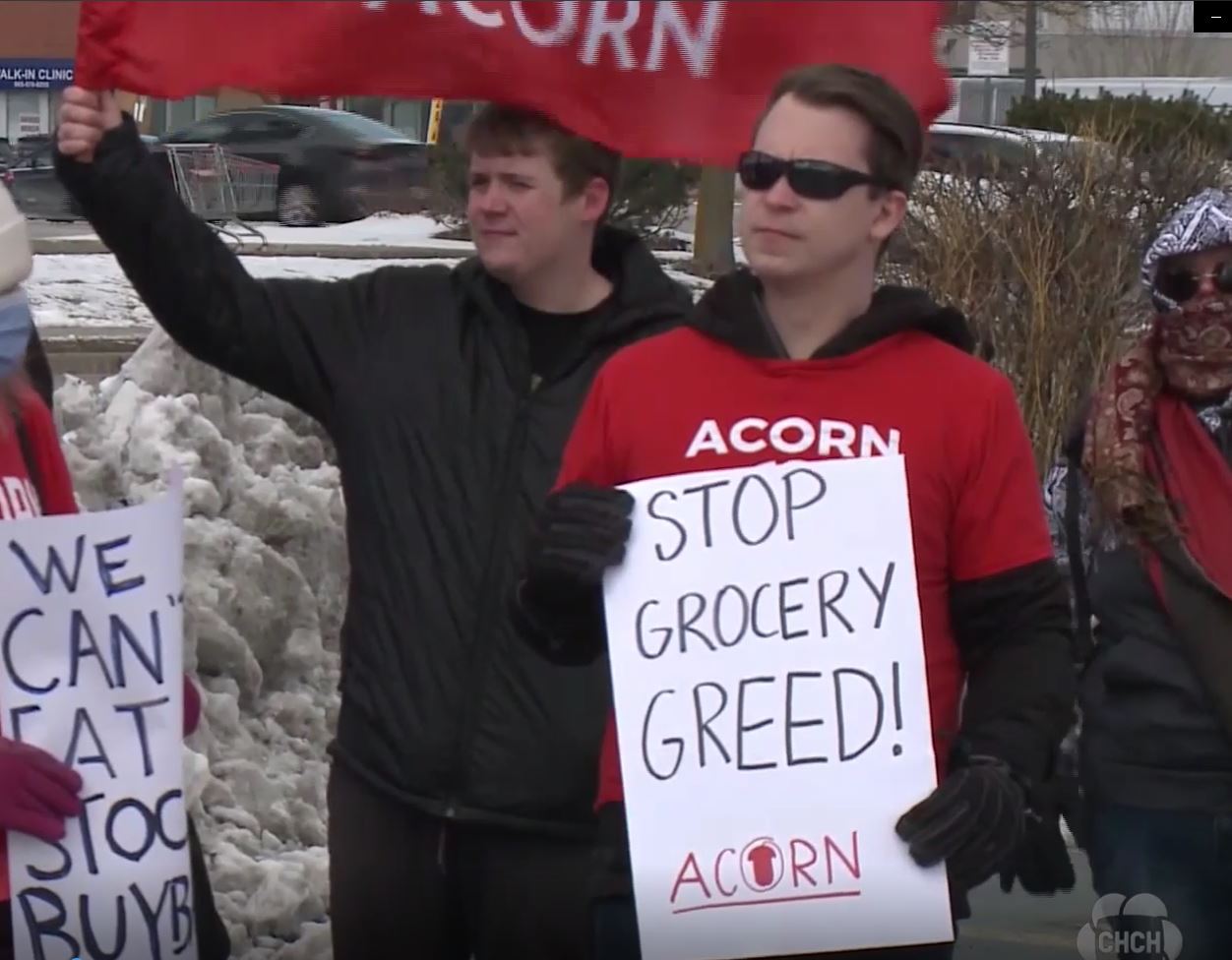 Alex protesting grocery greed